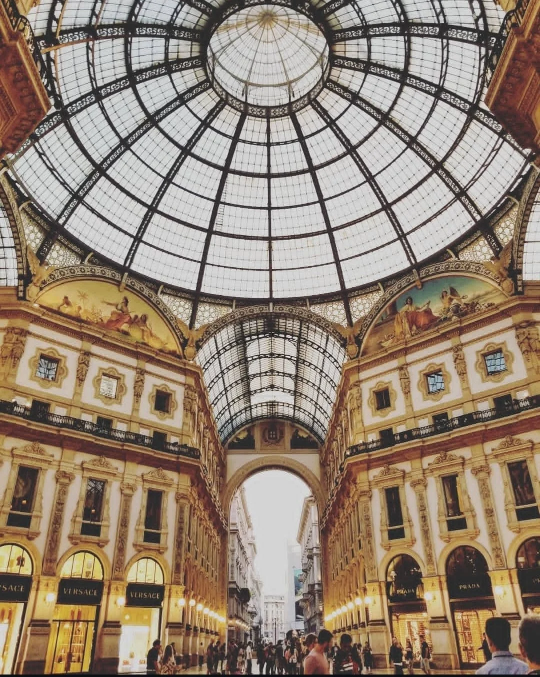 Glass-domed shopping gallery with ornate architecture